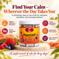 A jar of Hey! Basics MagnaCALM liquid supplement centered on a light wood surface, surrounded by fresh berries and orange fabric, with marketing text and icons about magnesium, alpha-wave support, and vegan/non-GMO qualities.