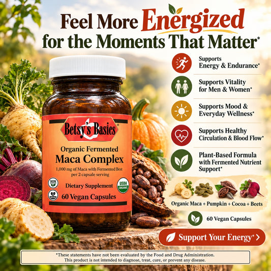 Betsy's Basics Organic Fermented Maca Complex dietary supplement bottle, 60 vegan capsules, displayed on a rustic background with fresh maca roots, pumpkins, and herbs, accompanied by product benefits and support badges.