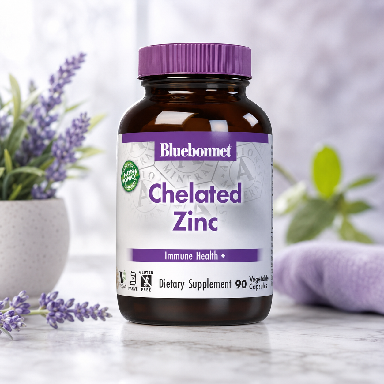 A bottle of Bluebonnet Chelated Zinc dietary supplement, featuring an amber glass bottle and a purple cap, set on a marble surface with lavender flowers and a soft-focus background.