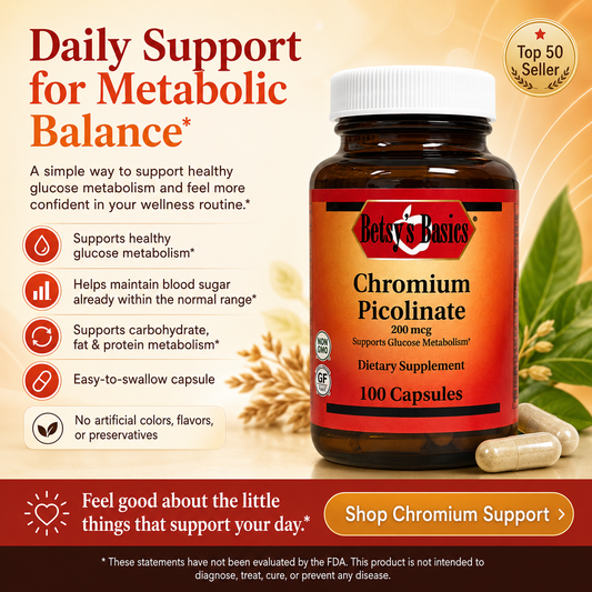 A bottle of Belvés Basics Chromium Picolinate dietary supplement with a white cap and amber-brown bottle, shown alongside capsules and wheat on a warm beige background with promotional text.