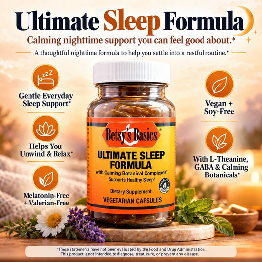 Betsy's Basics Ultimate Sleep Formula dietary supplement bottle shown on a warm, softly blurred background with decorative flowers and text callouts about sleep support, vegan and soy-free, melatonin-free, and botanical benefits.