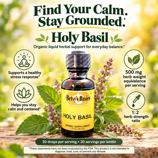 A bottle of Betsy's Basics Holy Basil herbal supplement centered on a rustic wooden surface with fresh basil leaves and flowers around it. The image includes marketing text and icons about stress support, calm and centered feeling, and herb strength ratio.