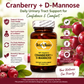 A bottle of Betsy's Basics Cranberry + D-Mannose dietary supplement centered on a white background with red cranberries around it and marketing text and icons on both sides.